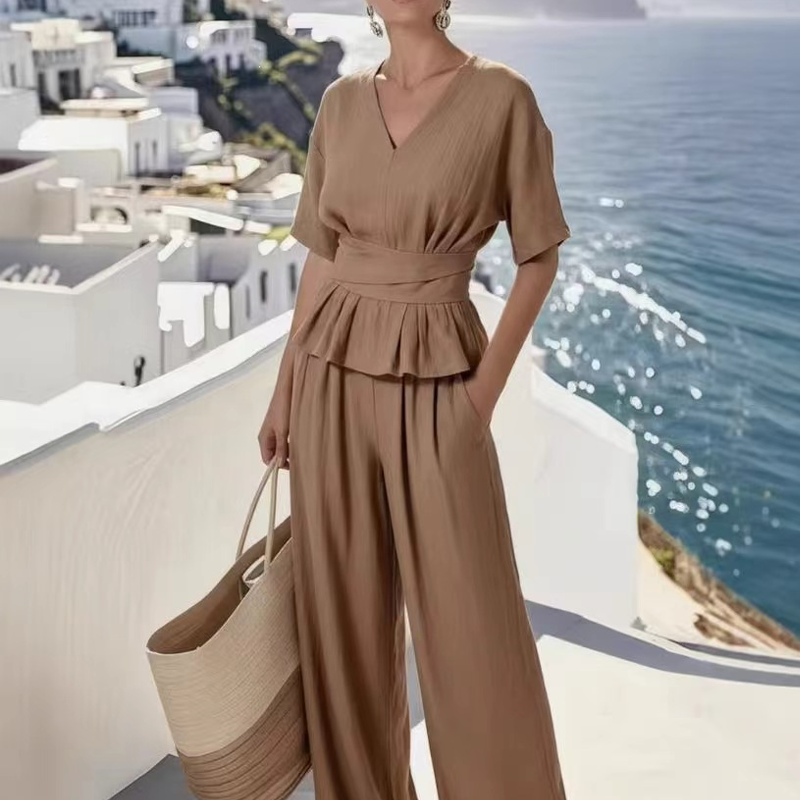 Set med topp med knytning i midjan och byxor med vida ben för damer