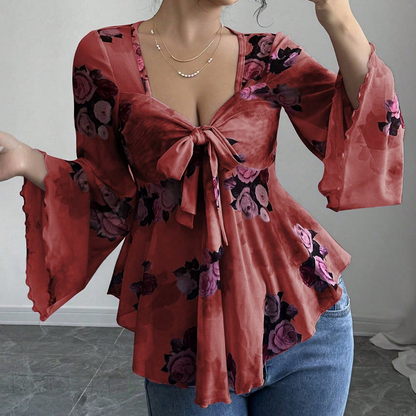 Blus för damer med blommönster, fyrkantig halsringning och knytning framtill