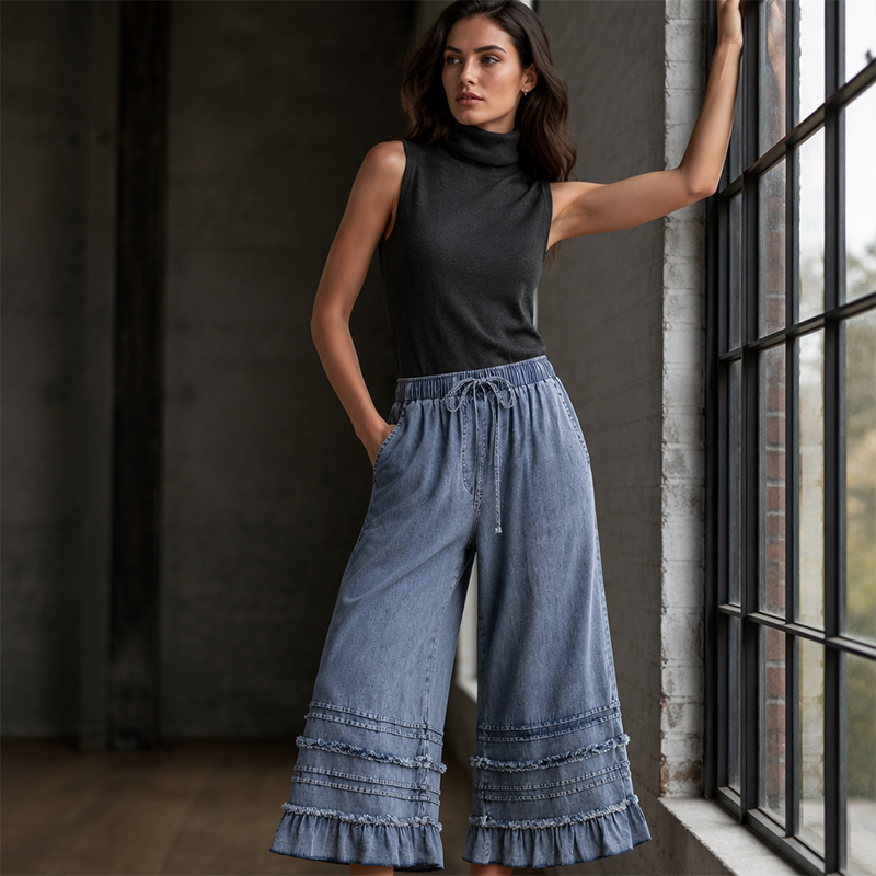 Dambyxor i Tencel-denim med volangkant och vida ben