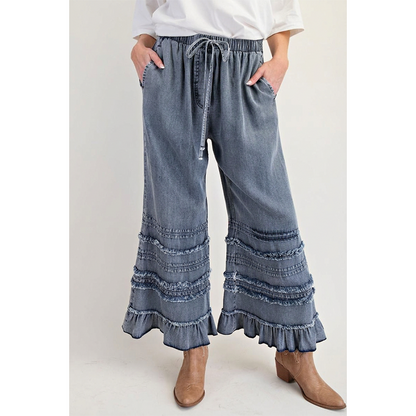Dambyxor i Tencel-denim med volangkant och vida ben
