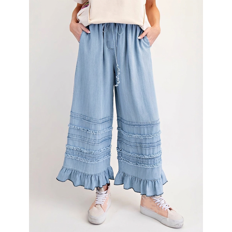 Dambyxor i Tencel-denim med volangkant och vida ben