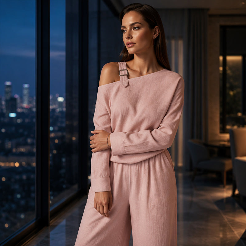 Elegant set för dam med enaxlad topp och byxor med vida ben